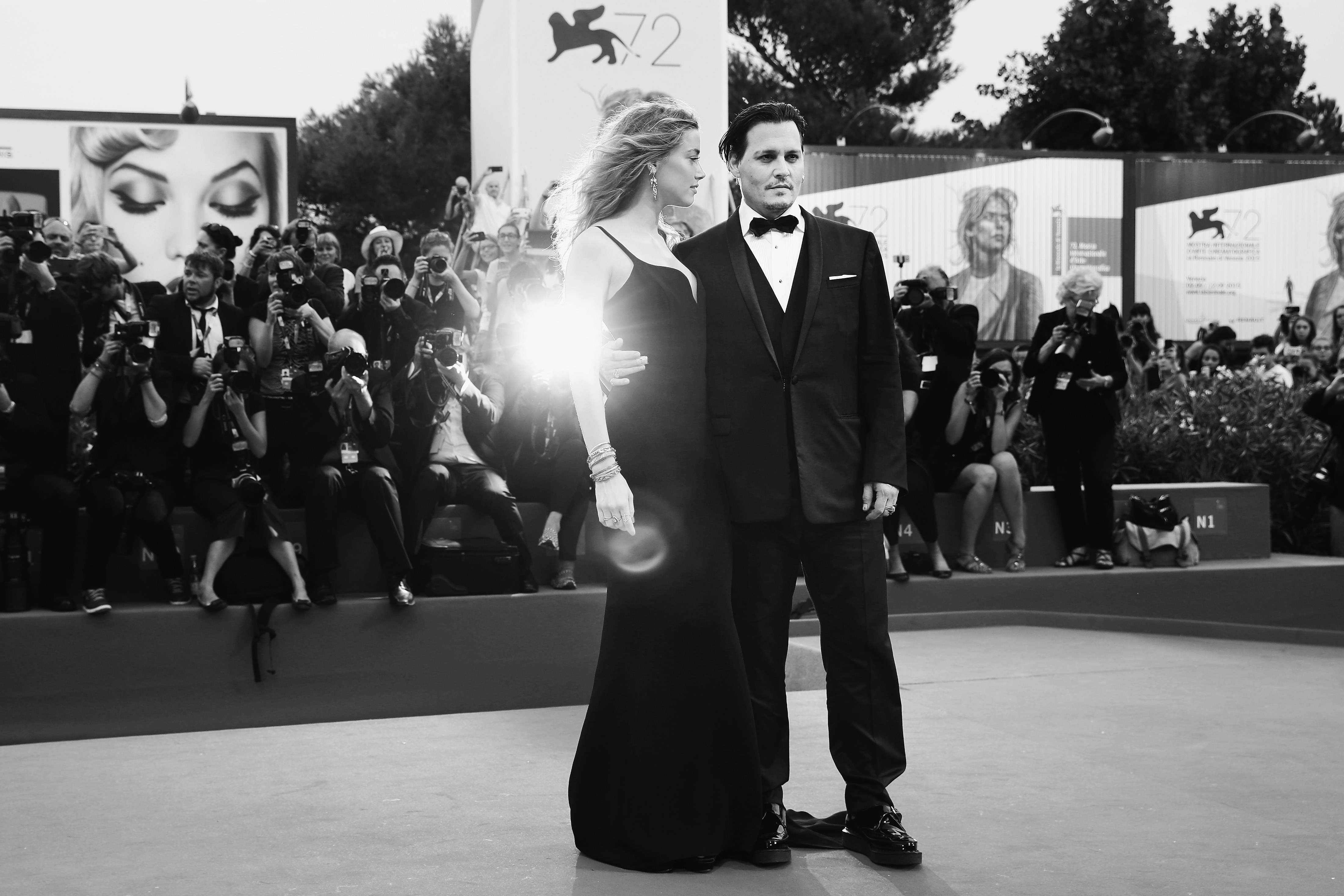 VENICE, ITALY - SEPTEMBER 03:  (EDITORS NOTE: Image has been converted to black and white)Johnny Depp and Amber Heard attend a premiere for 'Black Mass' during the 72nd Venice Film Festival at on September 4, 2015 in Venice, Italy.  (Photo by Vittorio Zunino Celotto/Getty Images)