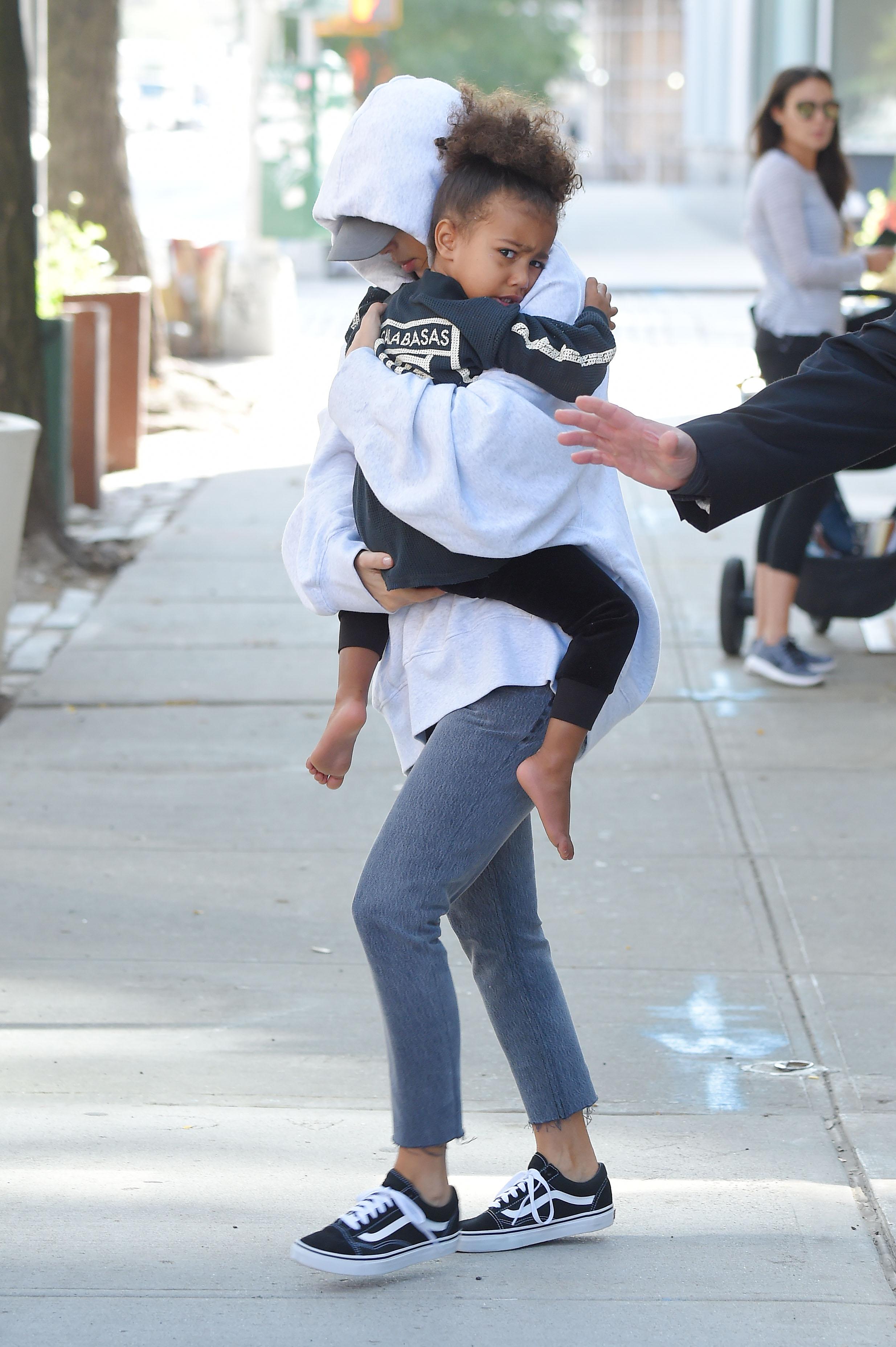Kim Kardashian and baby North West steps out  of ther AirBnB apartment for the first time after million dollar heist of her jewelry on OCTOBER 06, 2016 in New York City, New York