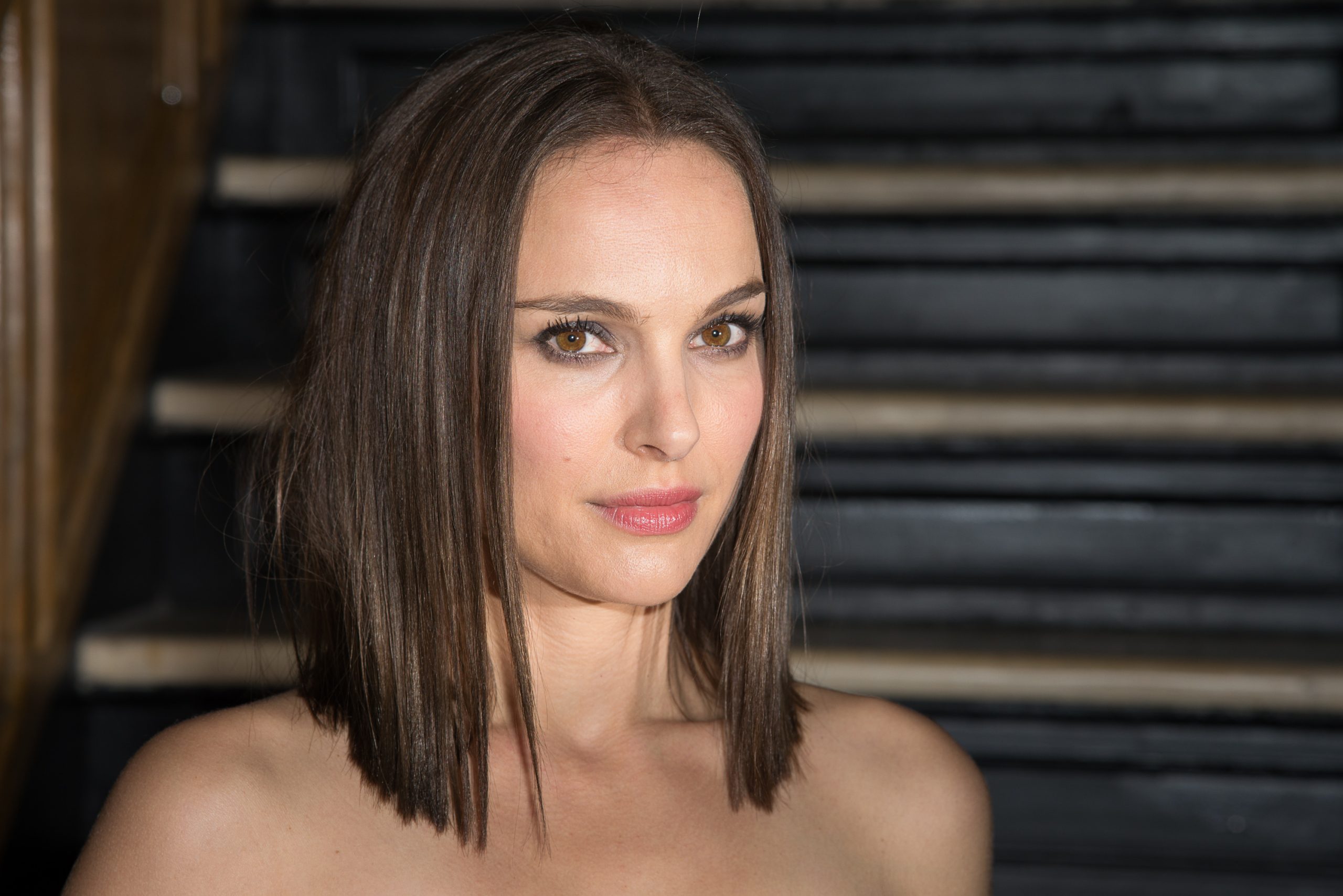 Natalie Portman wears a fun, classic suit with an extreme collar