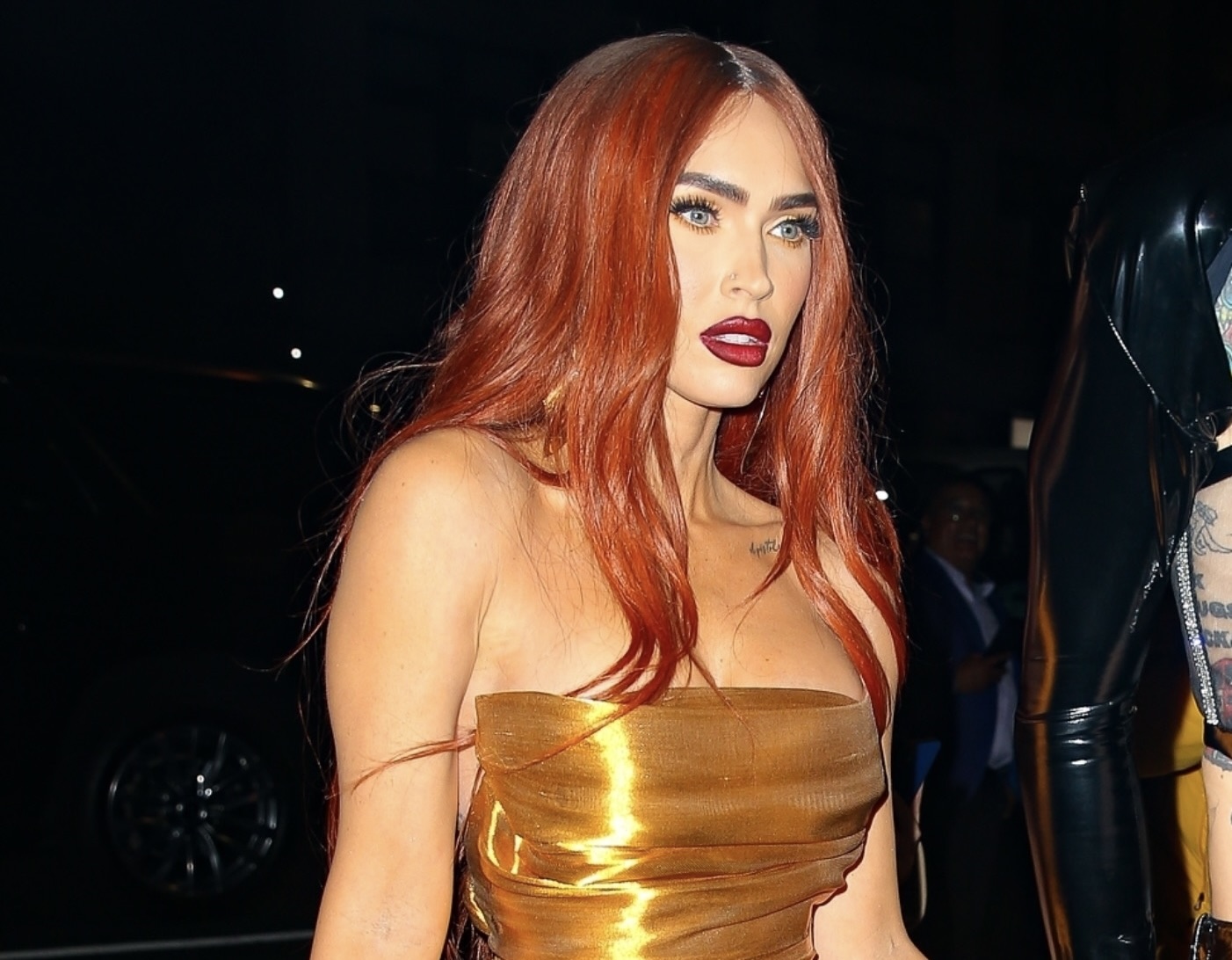 Megan Fox reincarnated as Jessica Rabbit: the actress came out in a seductive dress with fiery red hair