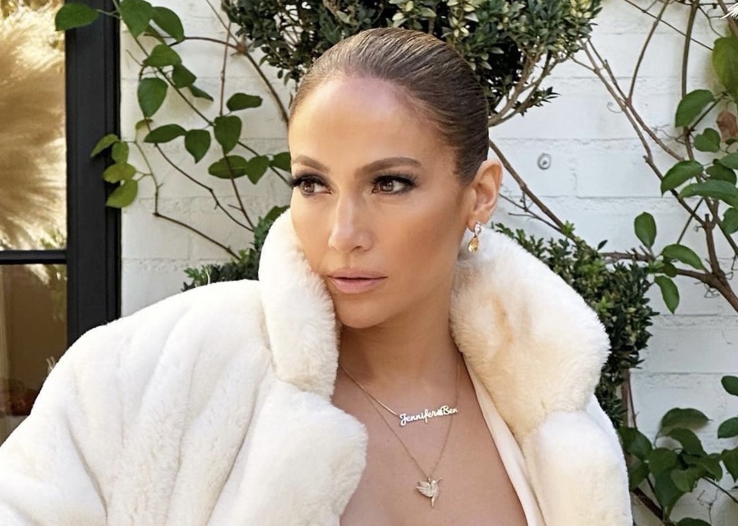 Jennifer Lopez tried on a dress with a very deep neckline (and a cozy fur coat to boot)