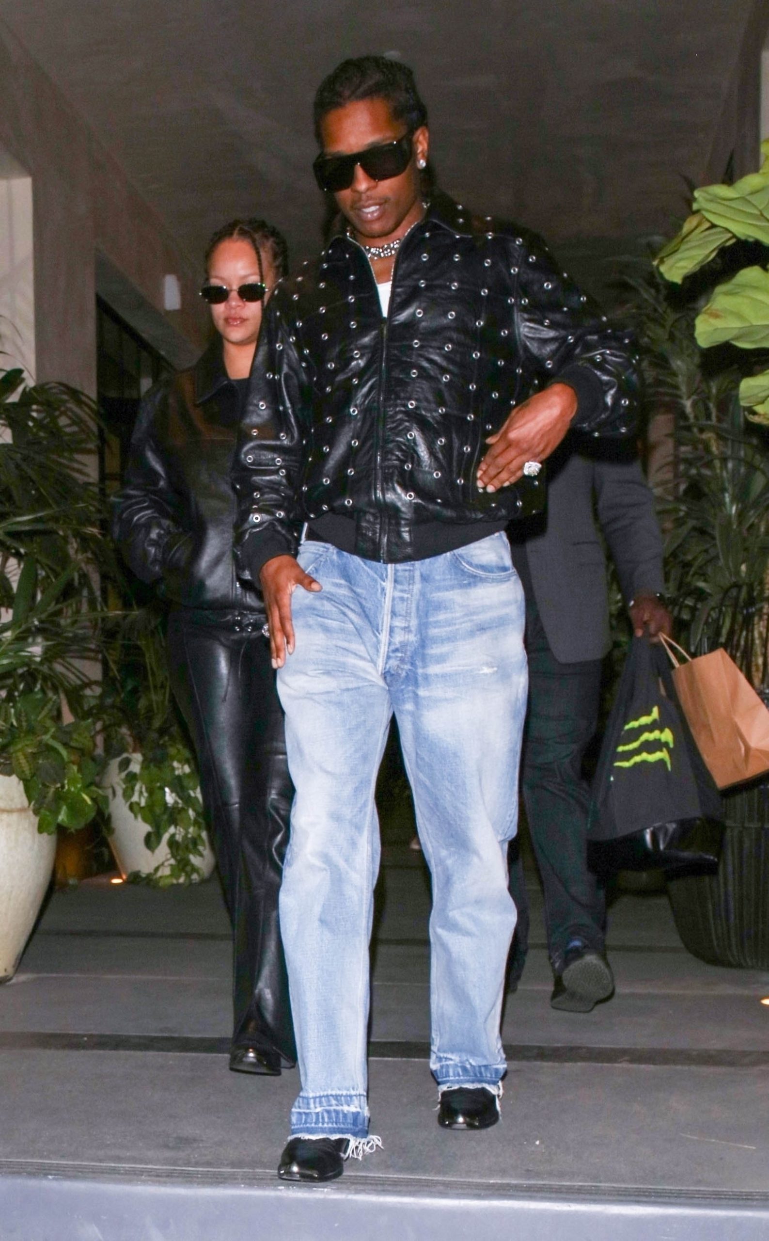 Teen rock star: Rihanna with leather bow goes on a date