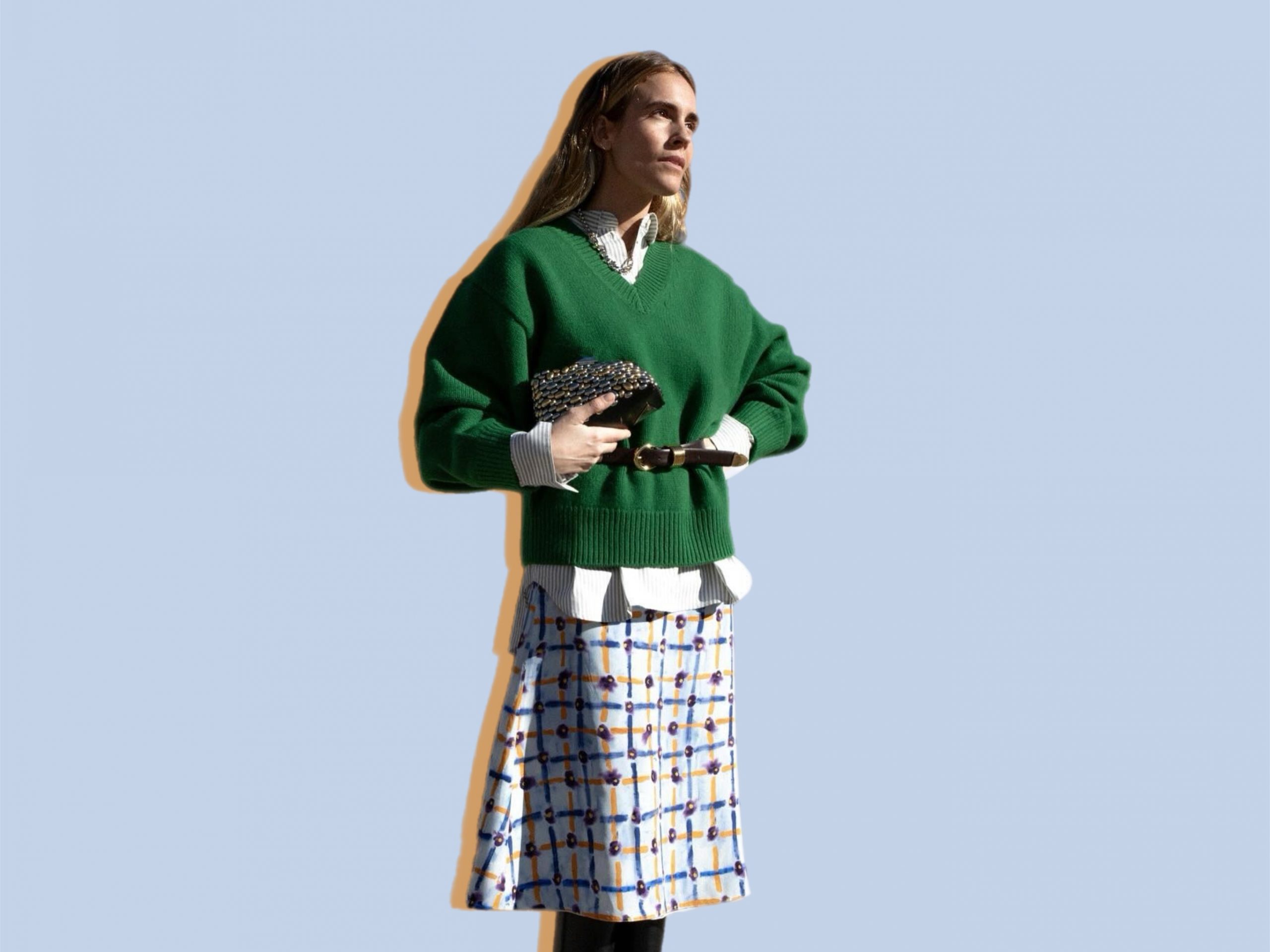 Wearing a belted sweater is trendy again.  Proven by fashion influencers