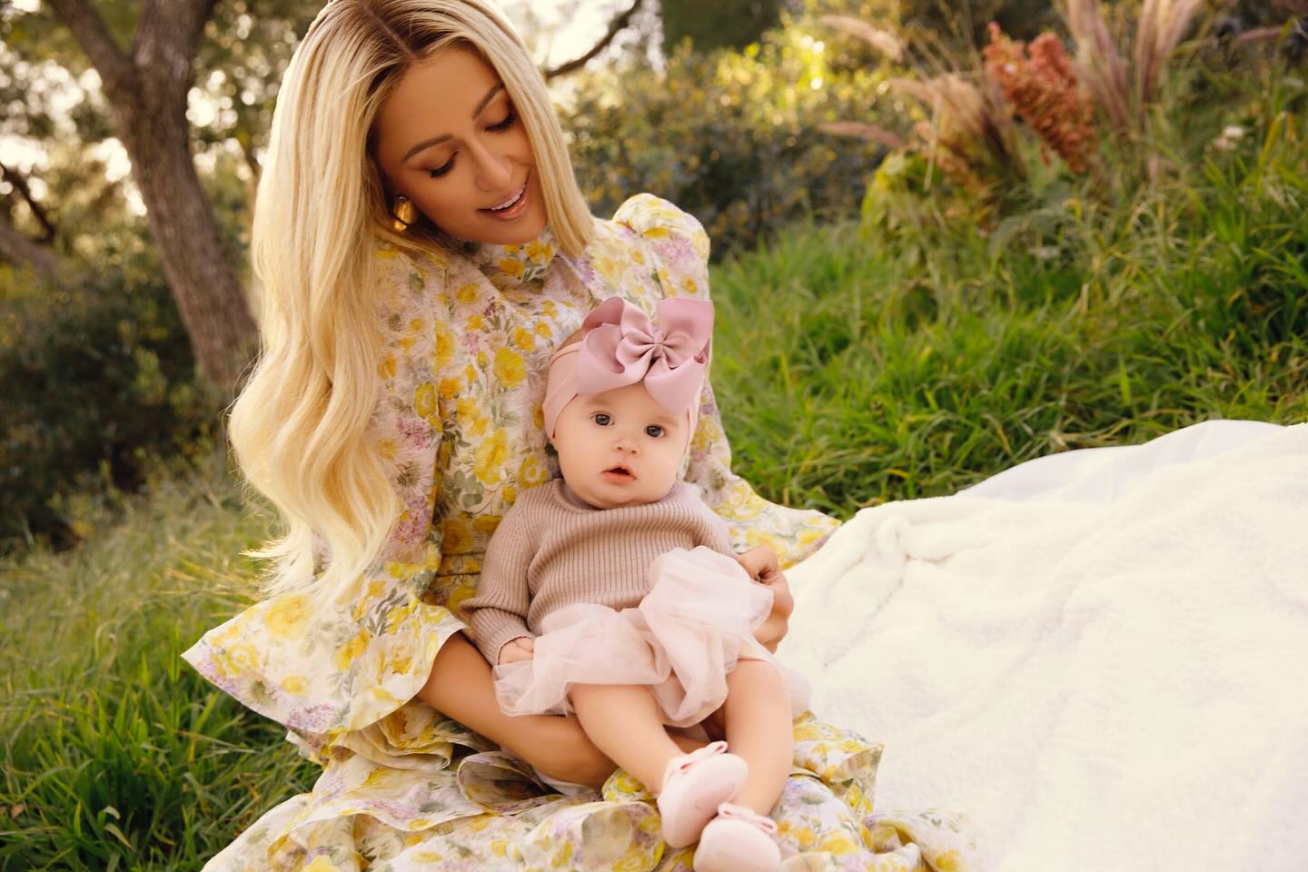 ‘I dream of the day when I can teach London the art of spray tanning!’: Paris Hilton jokes about her daughter’s looks
